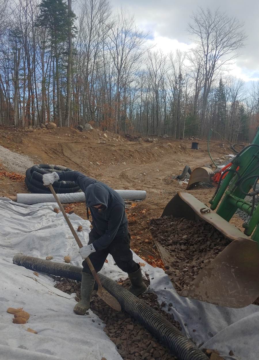 a man is shoveling through a hole in the ground